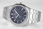 Stainless steel watch with blue dial and metal bracelet, angled top view
