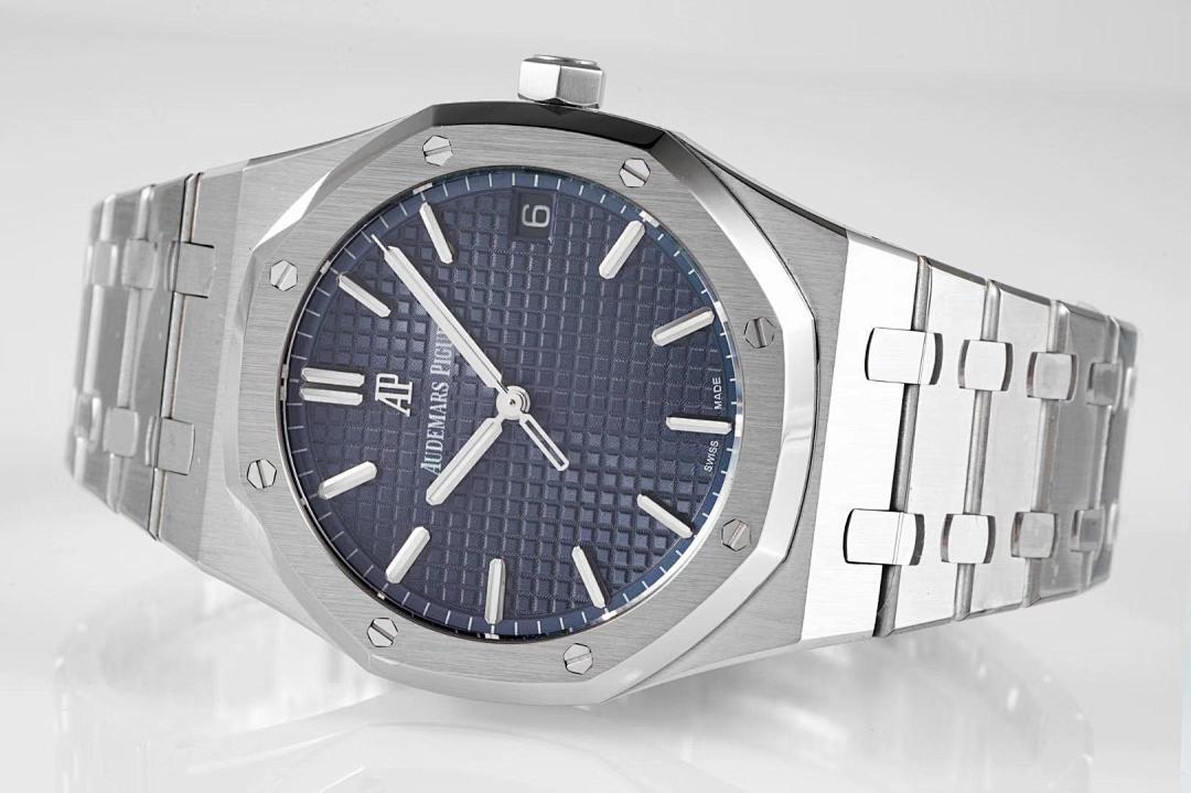 Stainless steel watch with blue dial and metal bracelet, angled top view