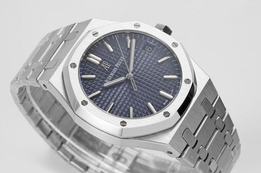 Stainless steel watch with blue dial and metal bracelet, three-quarter close-up