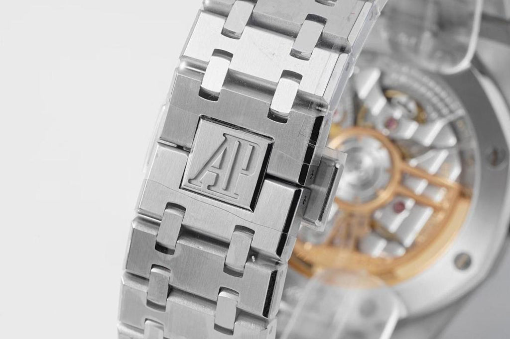 Wristwatch close-up with AP logo on silver bracelet and mechanical dial visible
