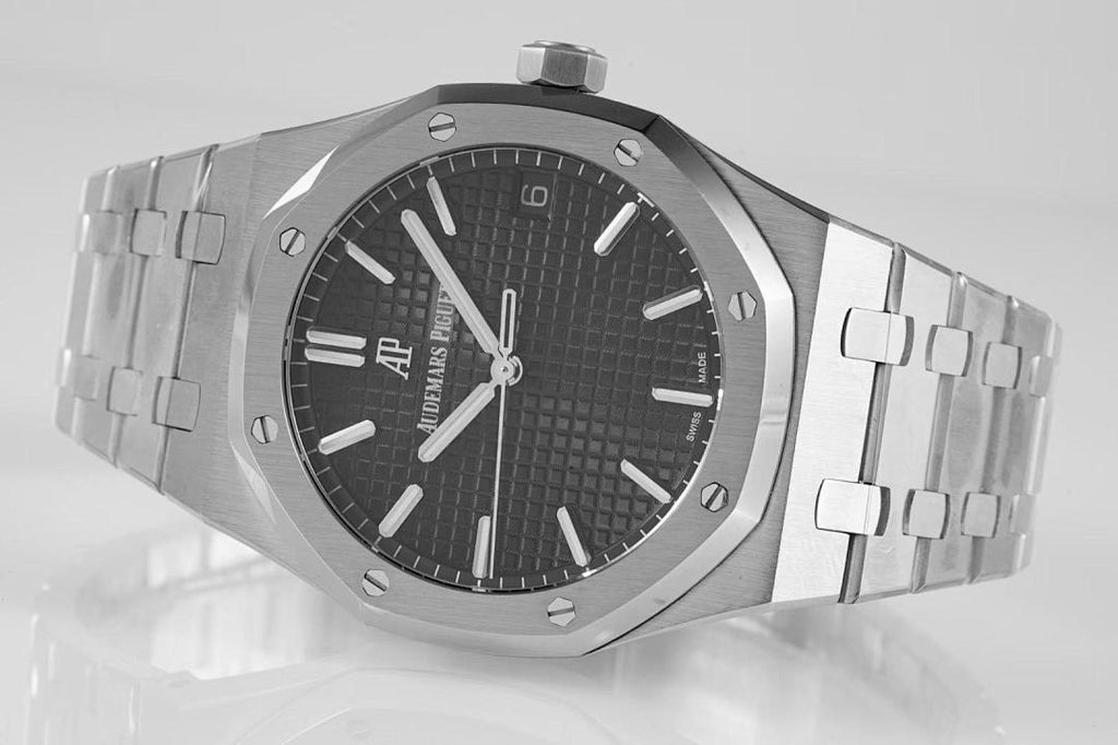 Wristwatch front view with black dial, white markers, and silver bracelet links