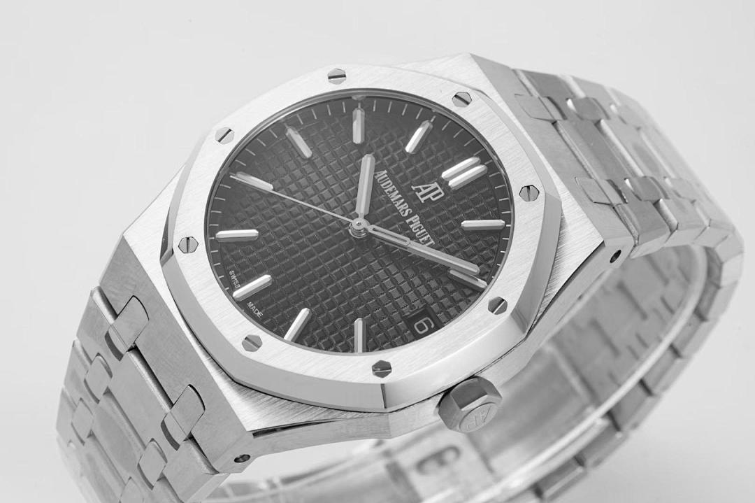 Wristwatch angled view with black dial, silver bezel, and silver link bracelet
