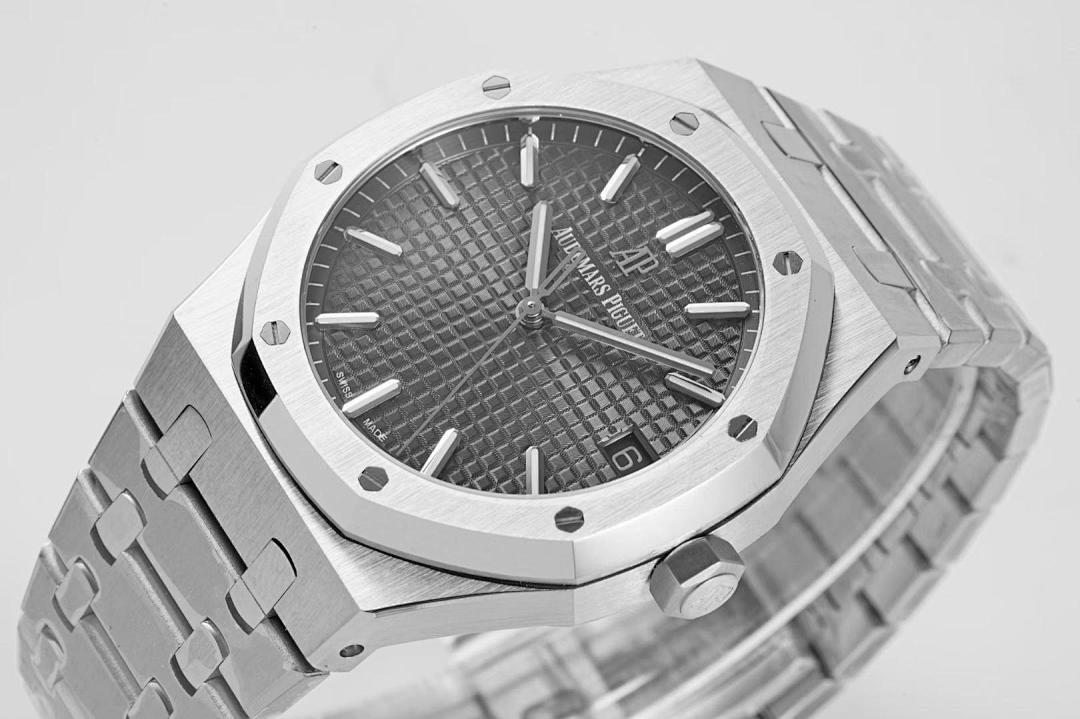 Audemars Piguet watch close-up dial with black textured pattern and steel bracelet