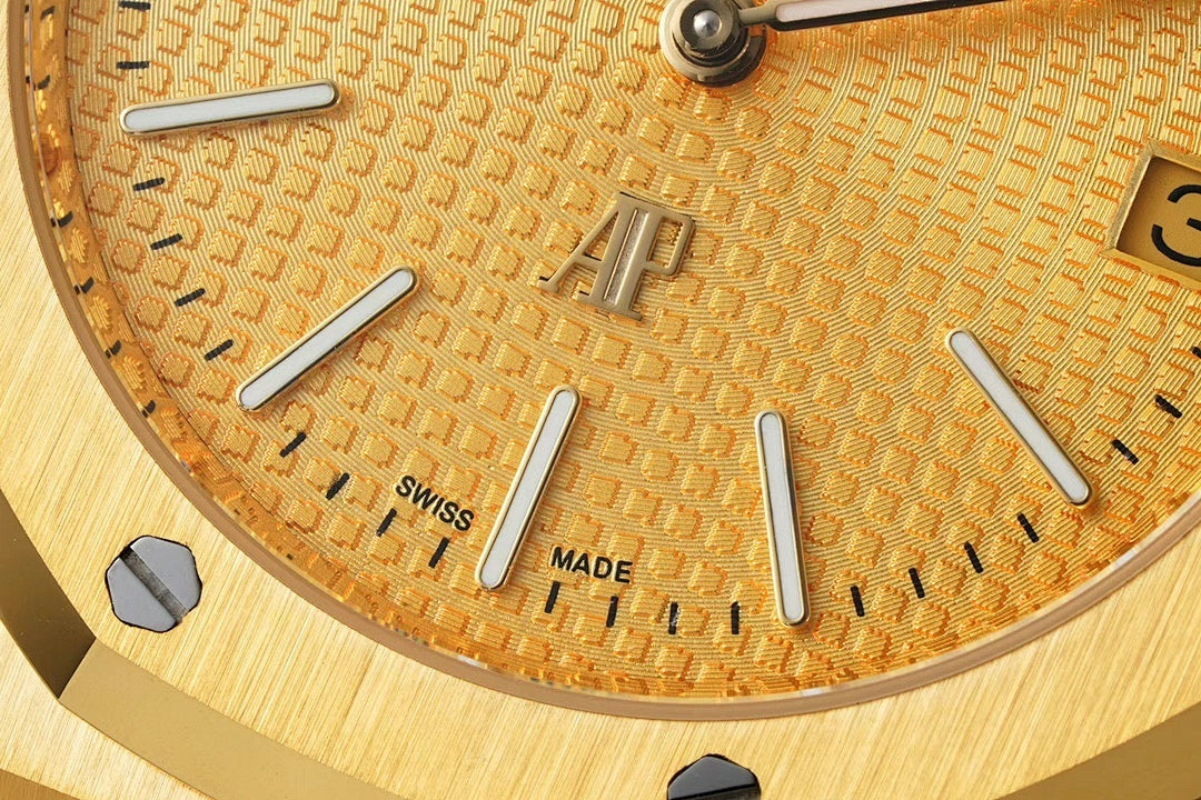 Gold-tone dial close-up with baton hour markers and text 'SWISS' and 'MADE'