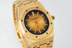 Gold-tone Audemars Piguet watch front view with black dial, baton hands, and date 16