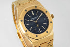 Gold-tone Audemars Piguet wristwatch close-up with dark blue dial and gold markers
