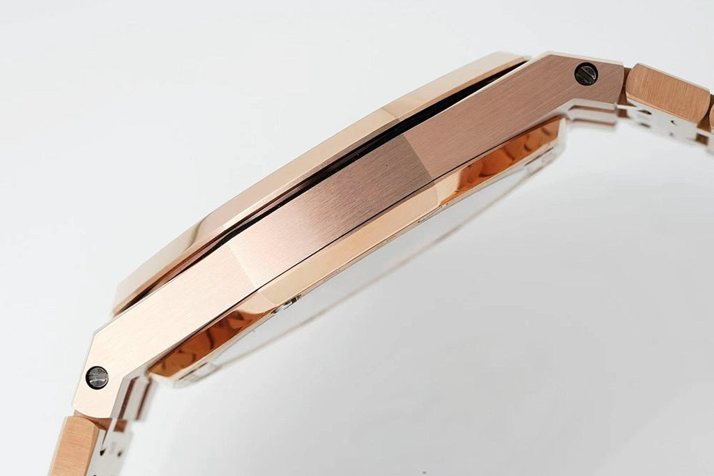 Rose gold-tone wristwatch case side with brushed finish and attached metal link bracelet.