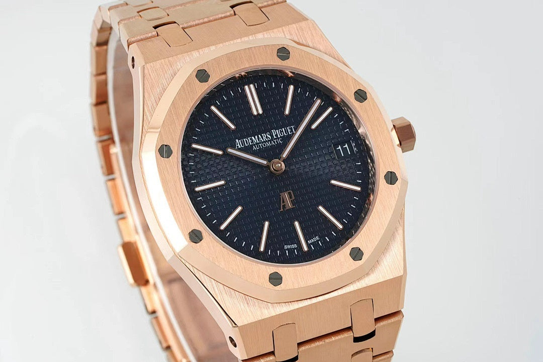 Rose gold-tone wristwatch close-up with dark blue dial, baton markers, and bezel details.