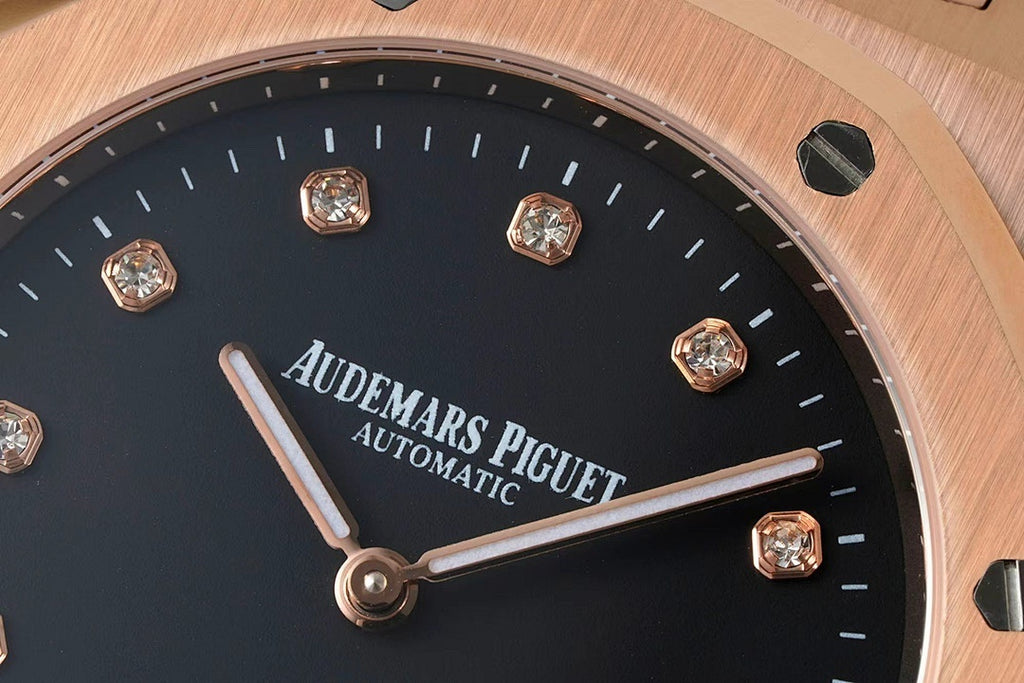 Audemars Piguet black dial close-up with rose-gold hands and diamond markers