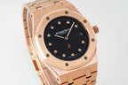Audemars Piguet rose gold watch with black dial and integrated bracelet, 3/4 angle