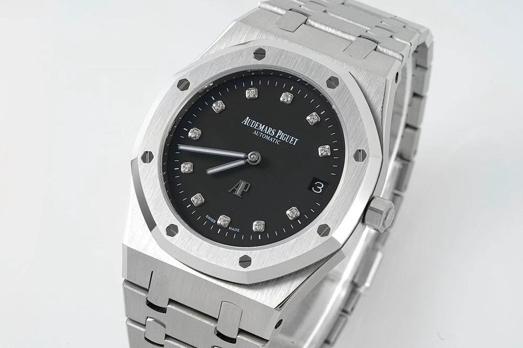 Audemars Piguet steel wristwatch with black dial, octagonal bezel, and link bracelet