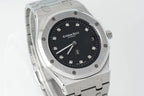 Audemars Piguet steel wristwatch with black dial, octagonal case, and metal bracelet