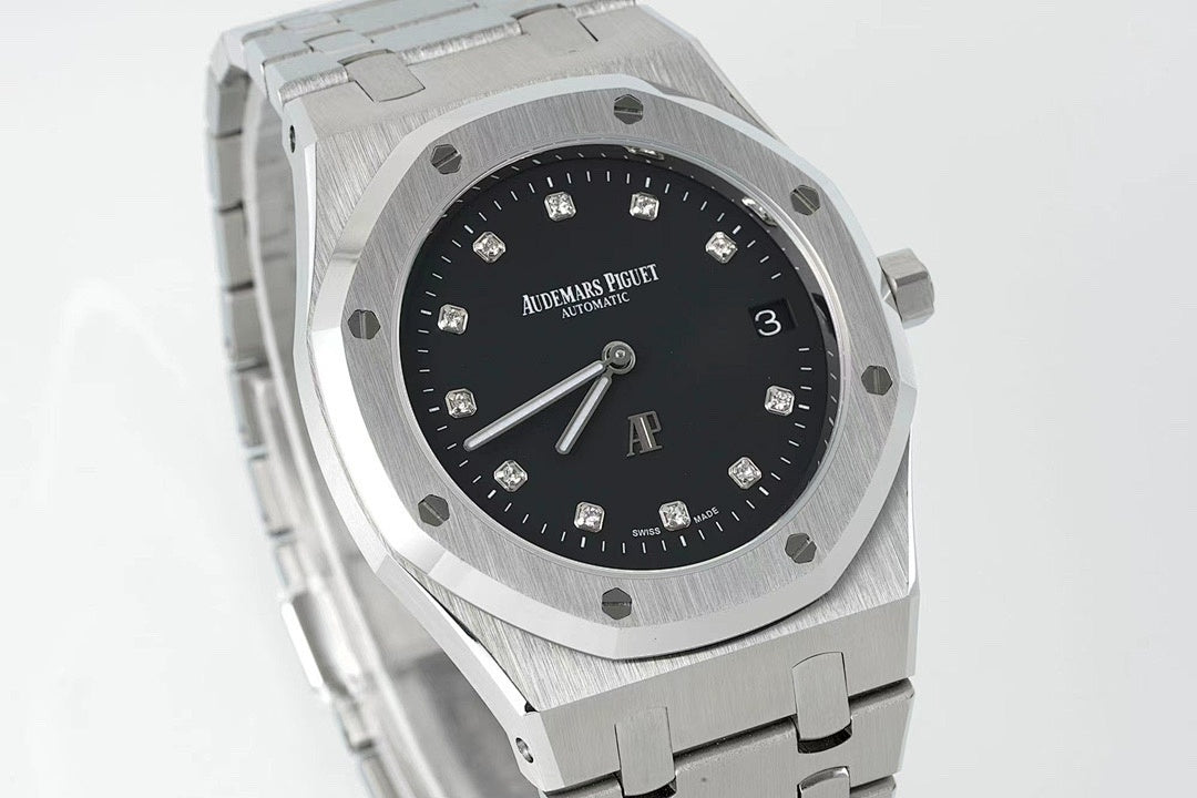 Audemars Piguet steel wristwatch with black dial, octagonal case, and metal bracelet