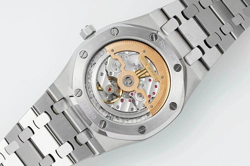 Stainless steel watch showing automatic movement through clear case, blue dial