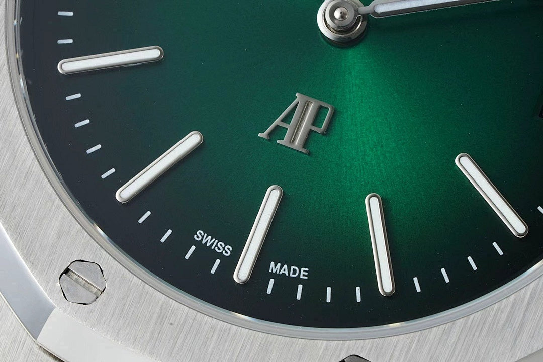 Audemars Piguet automatic watch close-up of green dial with AP logo and hour markers