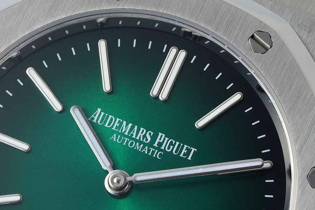 Audemars Piguet automatic watch green dial close-up with silver hour hands and baton markers