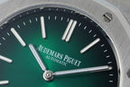 Audemars Piguet automatic watch green dial close-up with silver hour hands and baton markers