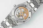 Men's stainless steel wristwatch with open dial showing gold-toned gears