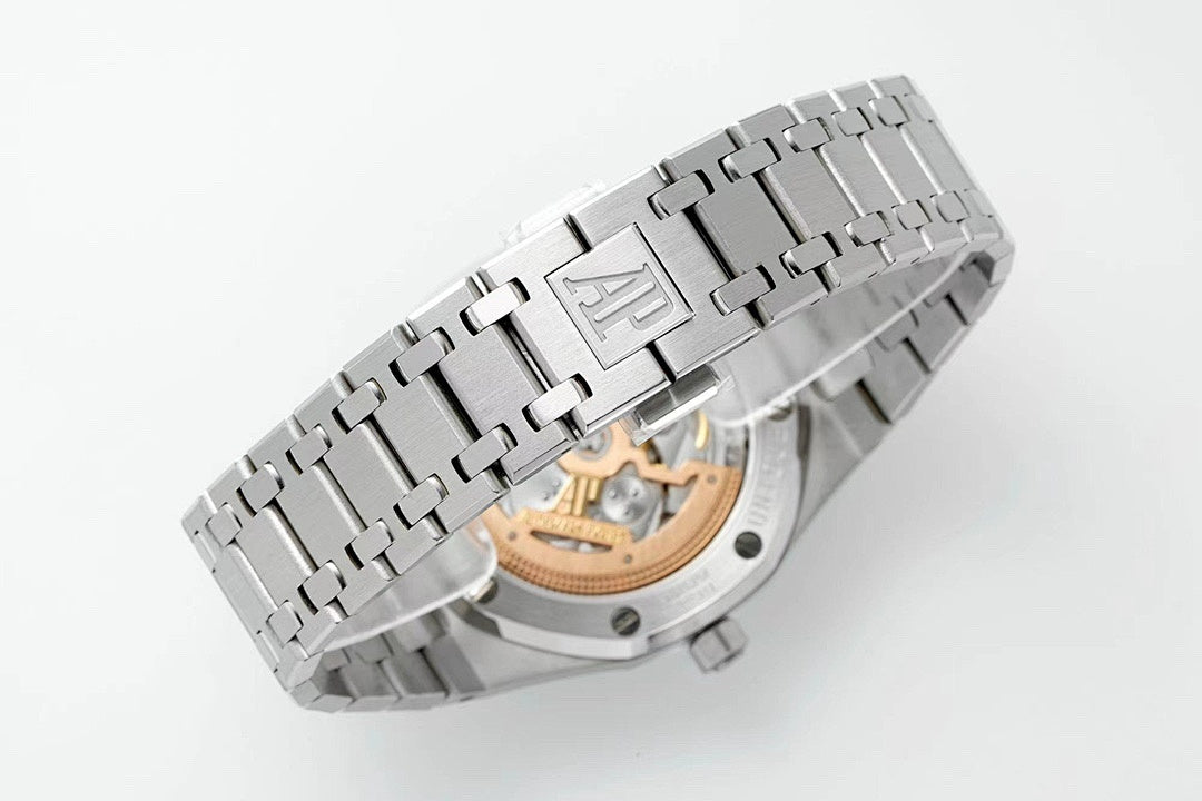 Stainless steel wristwatch with metal clasp and visible caseback details