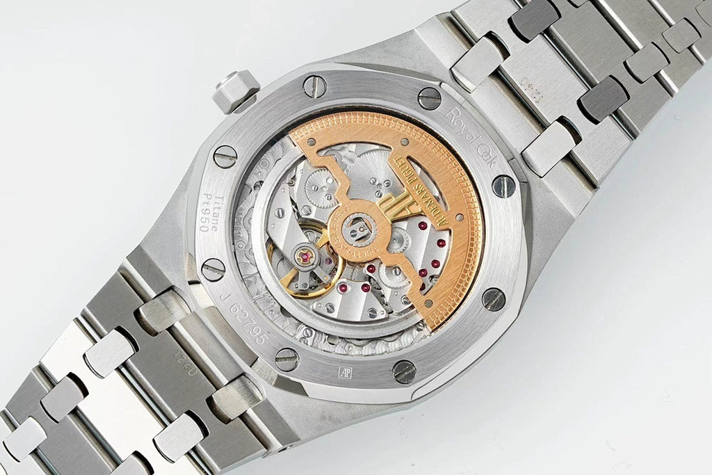 Audemars Piguet watch with exposed mechanical movement, stainless case and metal bracelet