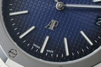 Audemars Piguet watch dial close-up with blue textured pattern, “SWISS MADE” text