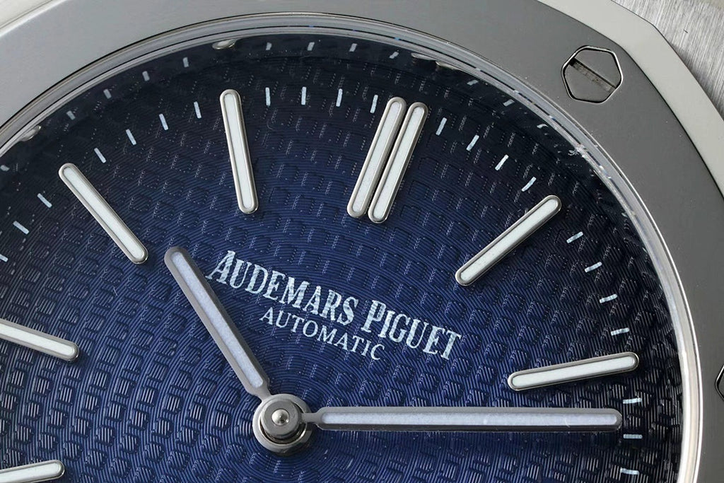 Audemars Piguet watch dial close-up with silver hour markers and “AUTOMATIC” text