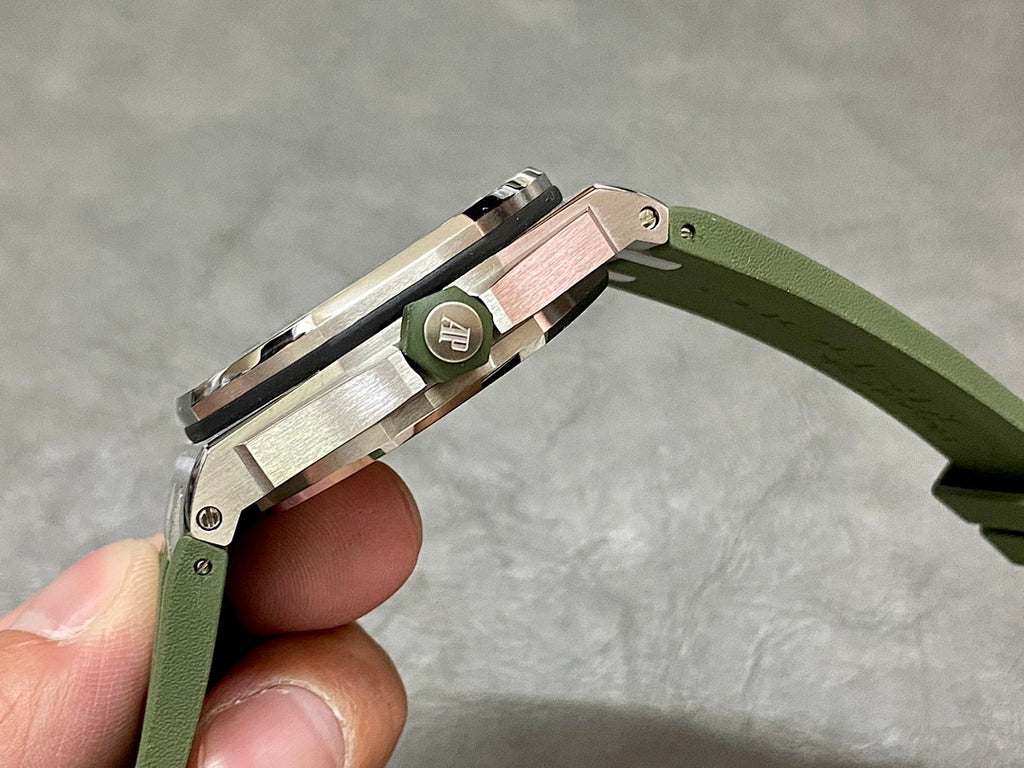Audemars Piguet watch crown side with green strap and brushed metal case