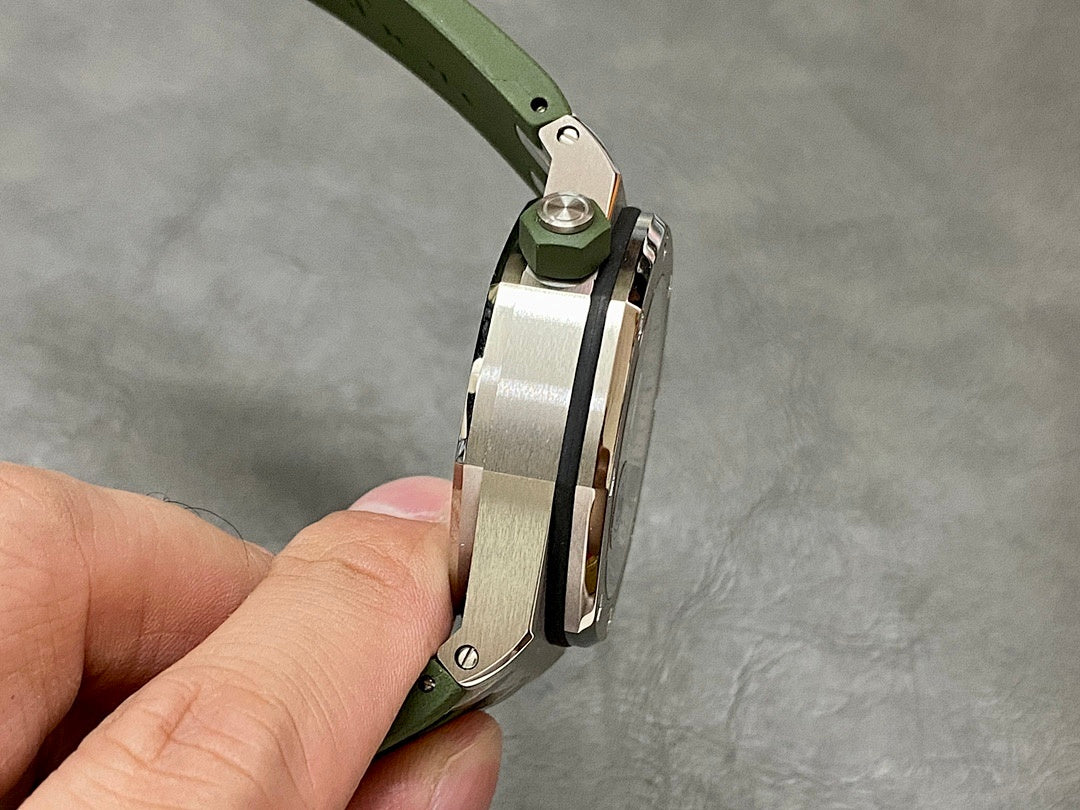 Side view of Audemars Piguet watch with green silicone strap and metal case