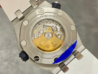 Audemars Piguet watch caseback with visible gold-toned movement and rubber strap