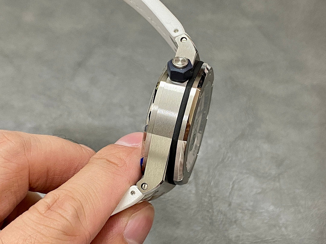 Audemars Piguet watch profile with metal case and white rubber strap