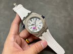 Audemars Piguet watch, angled view of white dial with blue hour track, white rubber strap
