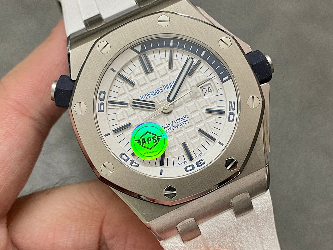 Audemars Piguet watch face close-up, white dial with blue markers, white rubber strap