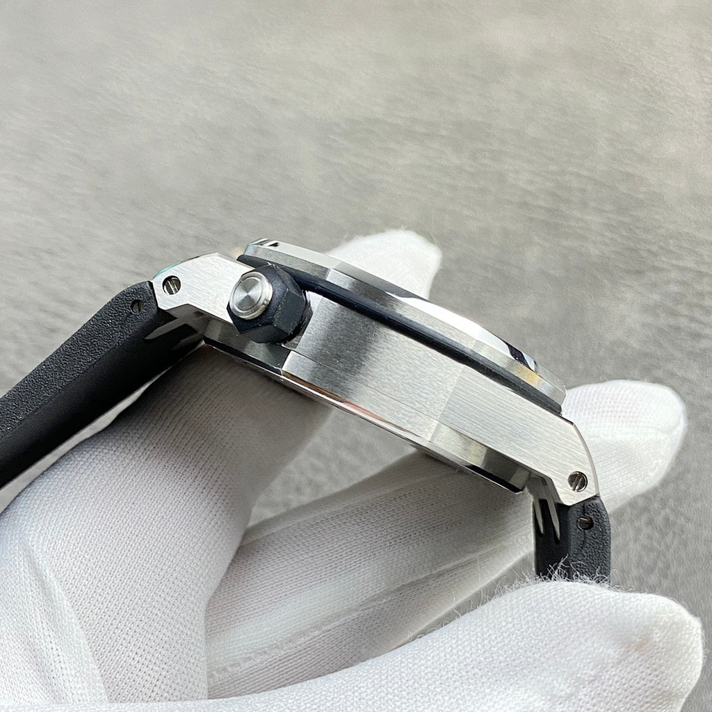 Audemars Piguet watch side view with brushed steel case and visible crown