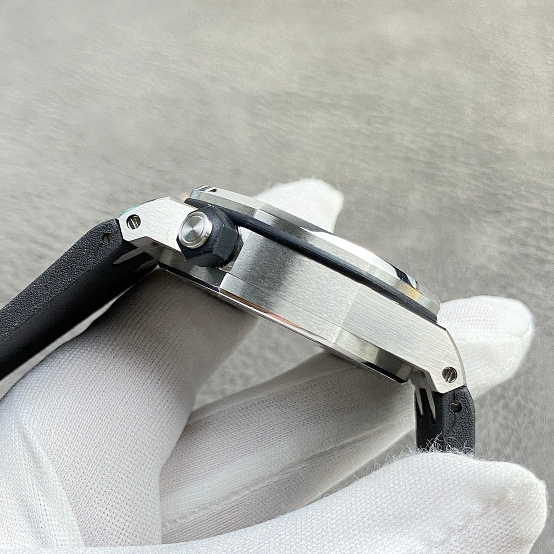 Audemars Piguet watch side view with brushed steel case and visible crown