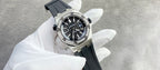 Audemars Piguet watch with dark leather strap, diamond bezel steel case