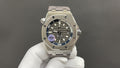 Audemars Piguet stainless steel watch with black dial, blue accents and crown guards