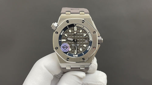 Audemars Piguet stainless steel watch with black dial, blue accents and crown guards