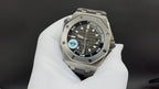 Audemars Piguet watch face, black dial with markers and subdials, stainless steel bracelet