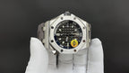 Audemars Piguet watch front view, black dial with subdials and bold markings, stainless steel