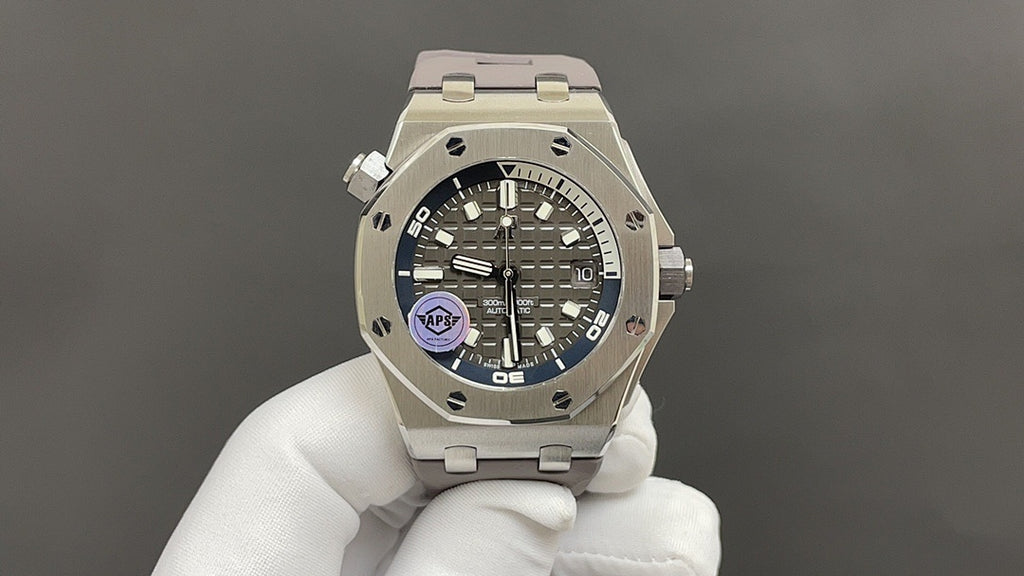 Audemars Piguet stainless steel watch on white glove, black dial with blue accent detail