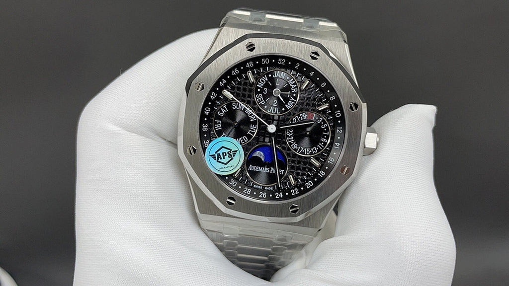 Stainless steel Audemars Piguet watch with black dial, subdials, and blue accent