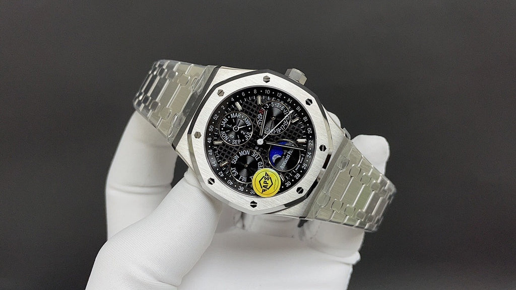 Stainless steel Audemars Piguet watch with black dial and metal bracelet, side view