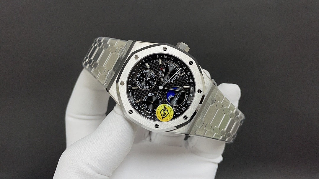 Stainless steel Audemars Piguet watch with black dial and metal bracelet, side view