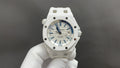 White sports watch with blue dial, date window, rubber strap