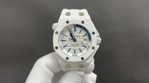 White sports watch with blue dial, date window, rubber strap