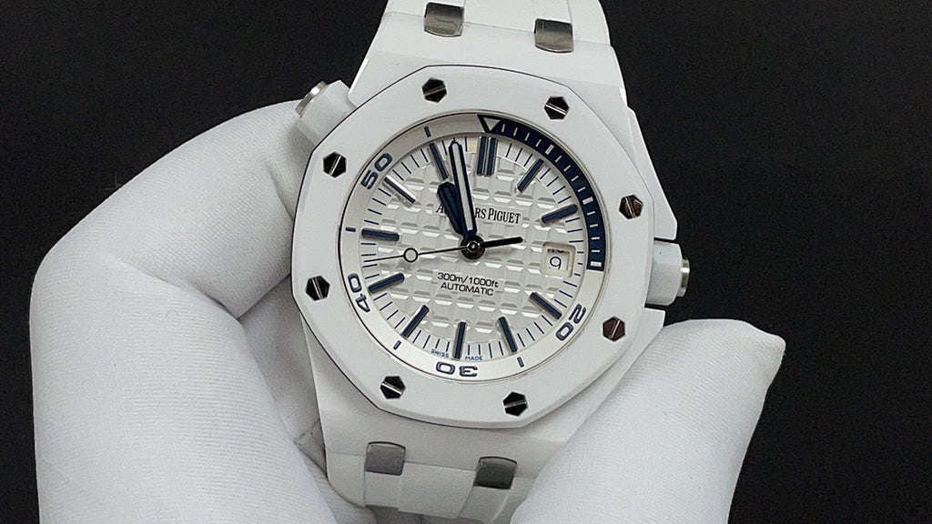 White sports watch with blue dial and luminous hour markers