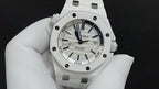 White sports watch with blue dial and luminous hour markers