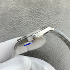 Audemars Piguet watch side close-up with crown and silver band links