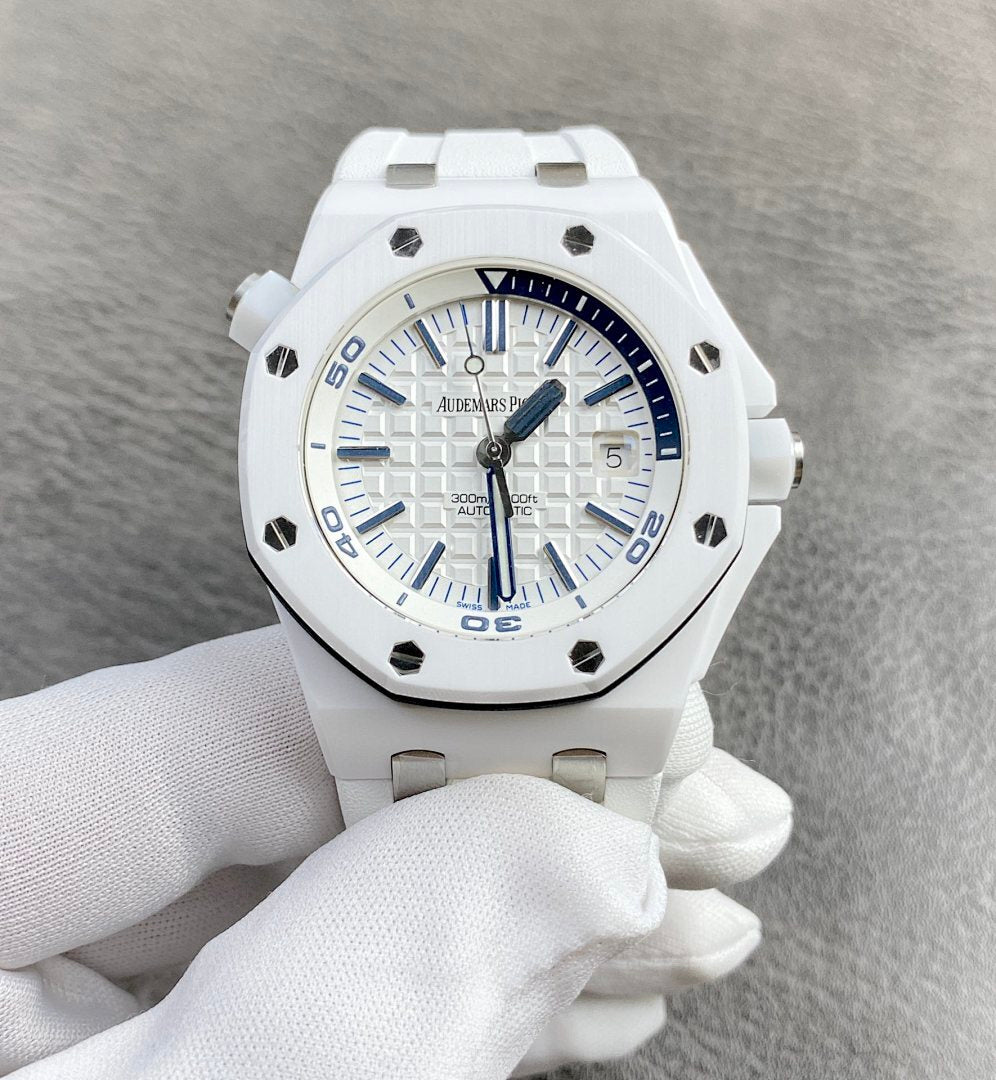 White rubber sports watch with blue dial, chronograph-style subdials, and black bezel accents.