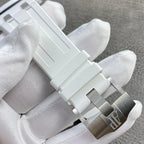 White rubber watch bracelet with metal clasp and brushed silver-toned links.